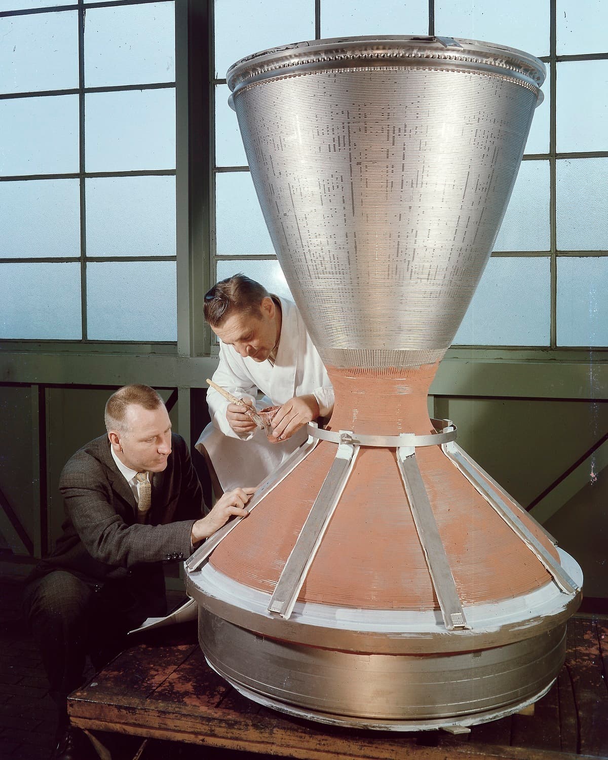 Scientist and business man inspecting a device for nuclear thermal rocketry
